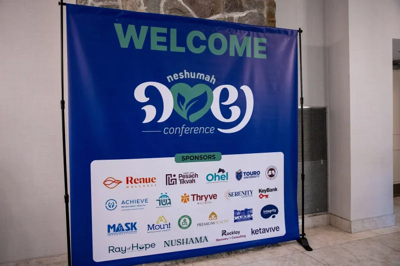 The welcome display at the 2025 Neshumah Conference