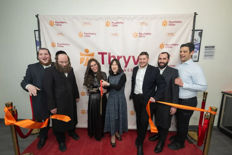 A group photo after the ribbon cutting in Williamsburg.