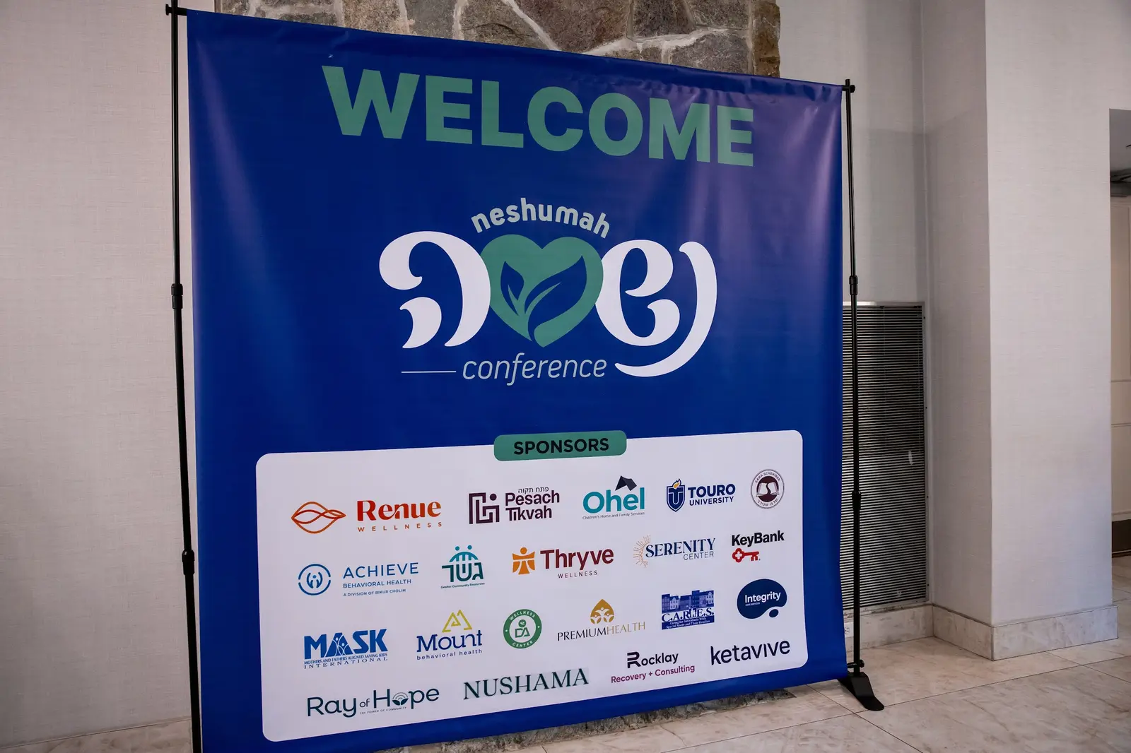 The welcome display at the 2025 Neshumah Conference