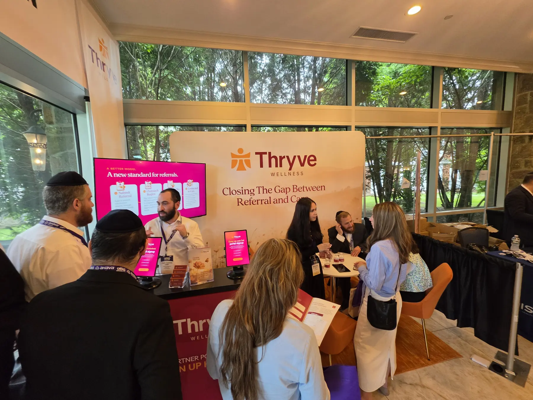 Visitors gathering at the Thryve Wellness booth during the 2026 Neshumah Conference