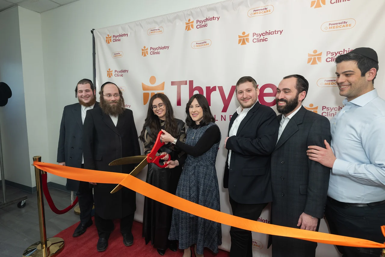 The ribbon-cutting moment in Williamsburg, with Thryve’s name visible behind the team